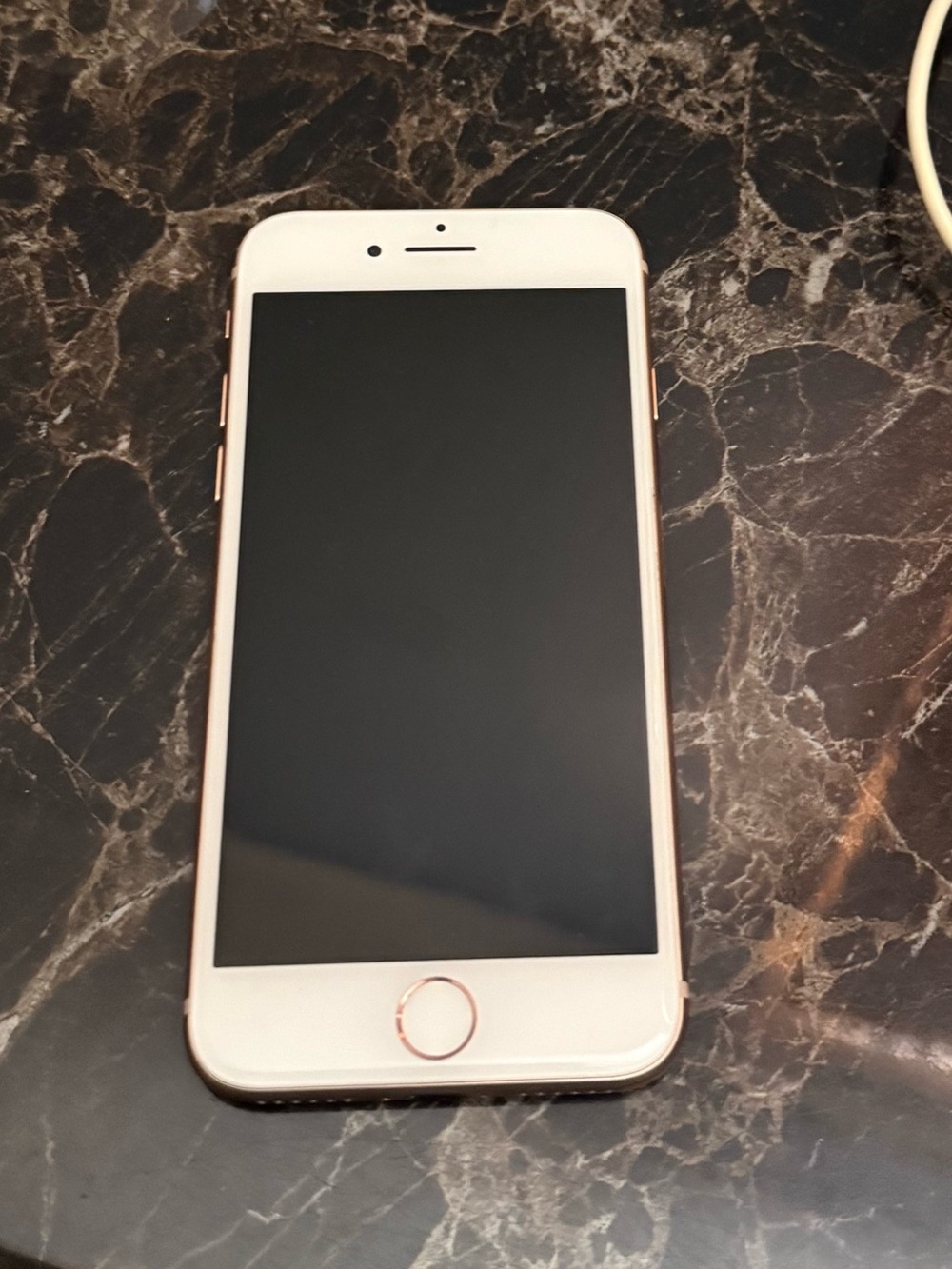 Apple iPhone Rose Gold with White Lightning Cable